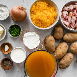 Ultimate Potato Soup ingredients spread out on counter and in different sizes of prep bowls.