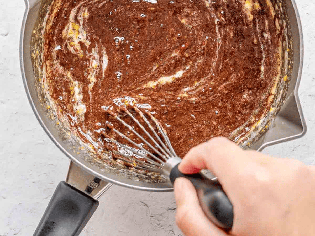 Mixing chocolate in tempered egg mixture