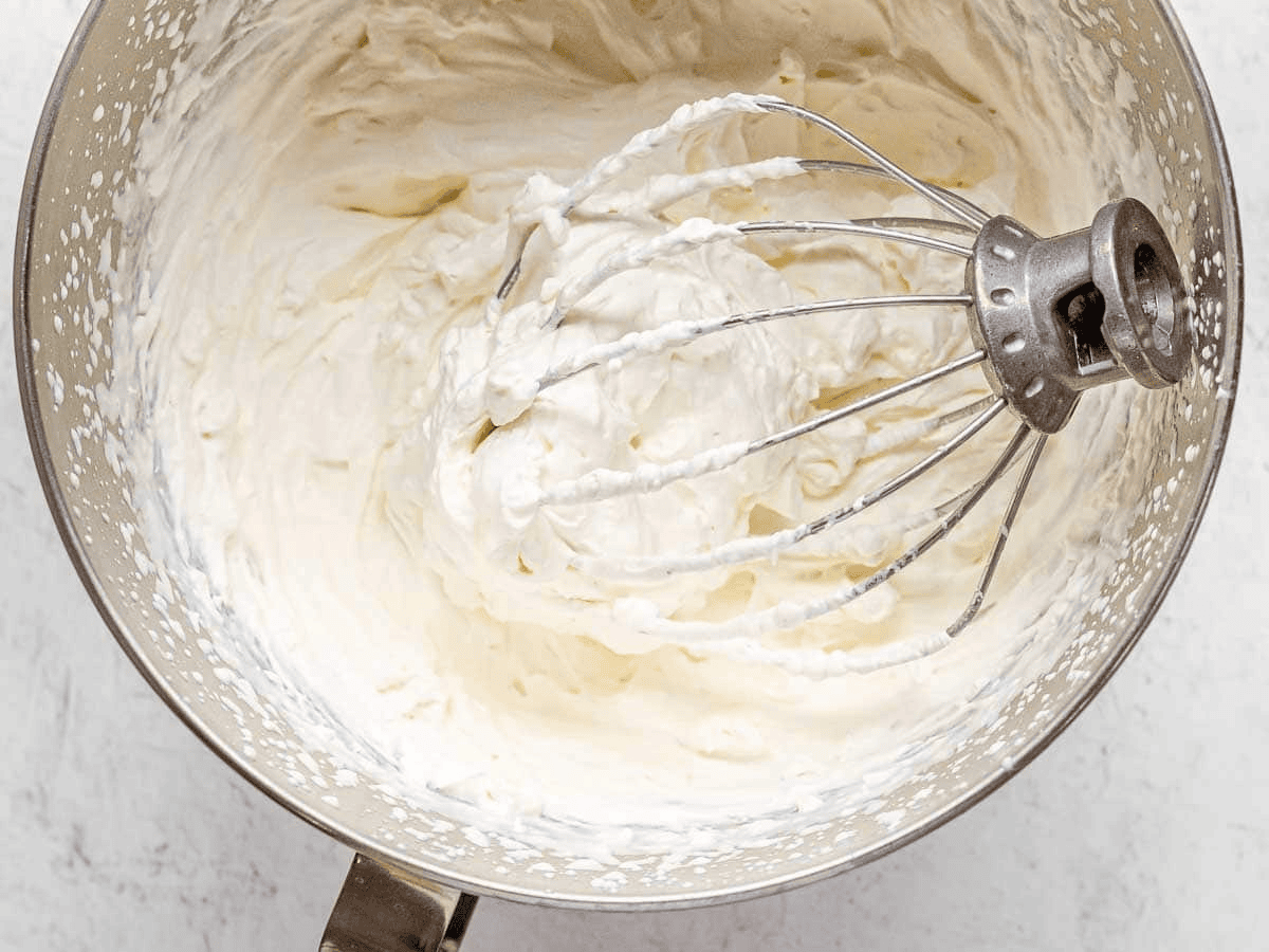 Whipped cream in a mixing bowl