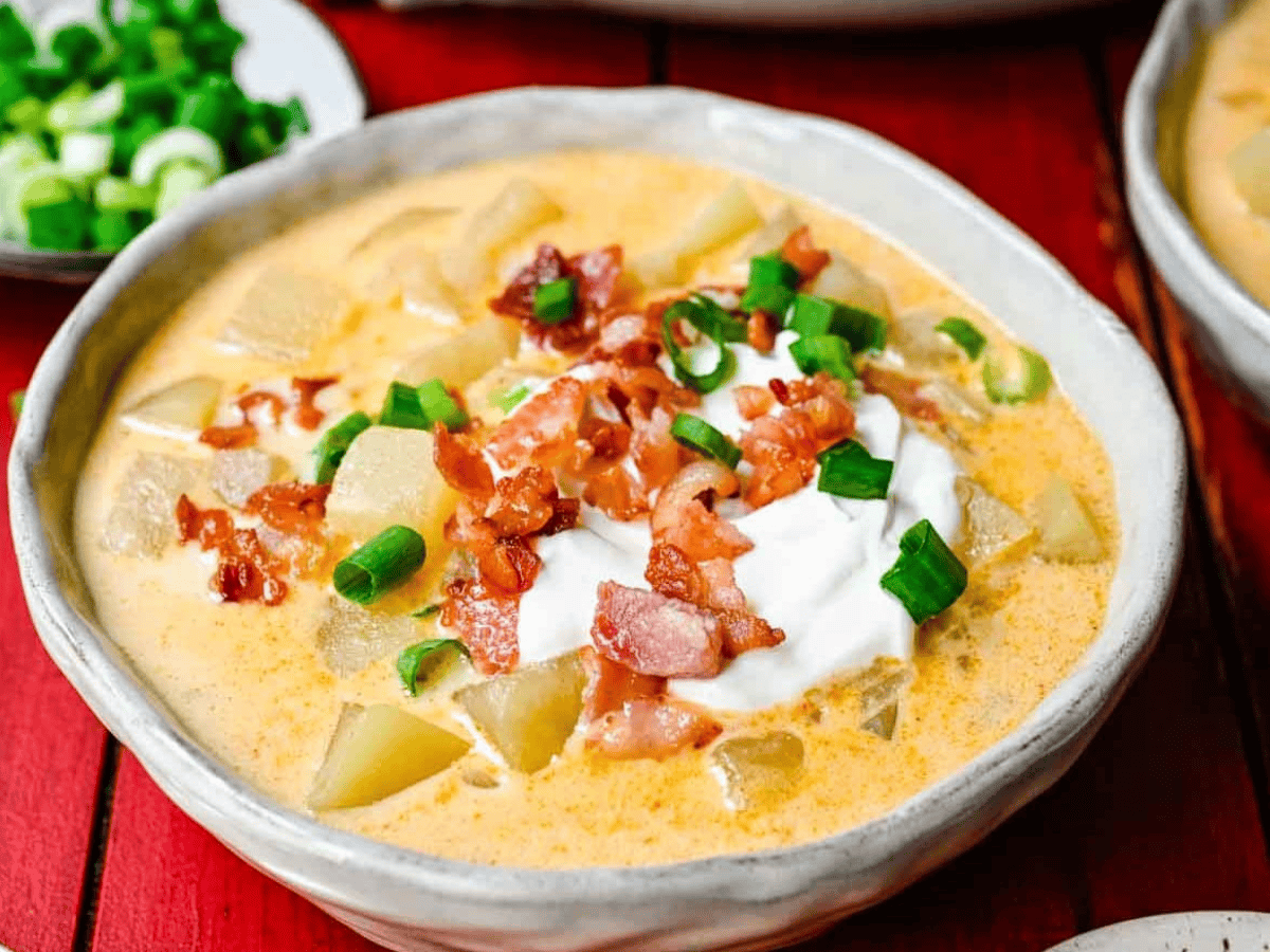 Soup served in white bowl with ganishments