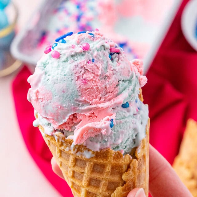 Bubble gum ice cream in waffle cone.