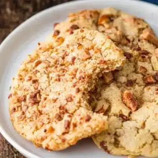 Baked goods on a plate with bite taken out