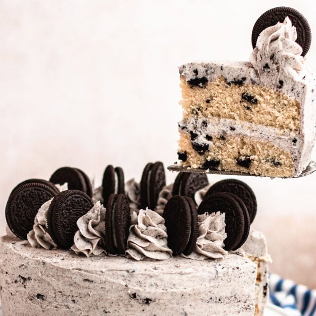 Cookies and cream cake with slice being served.