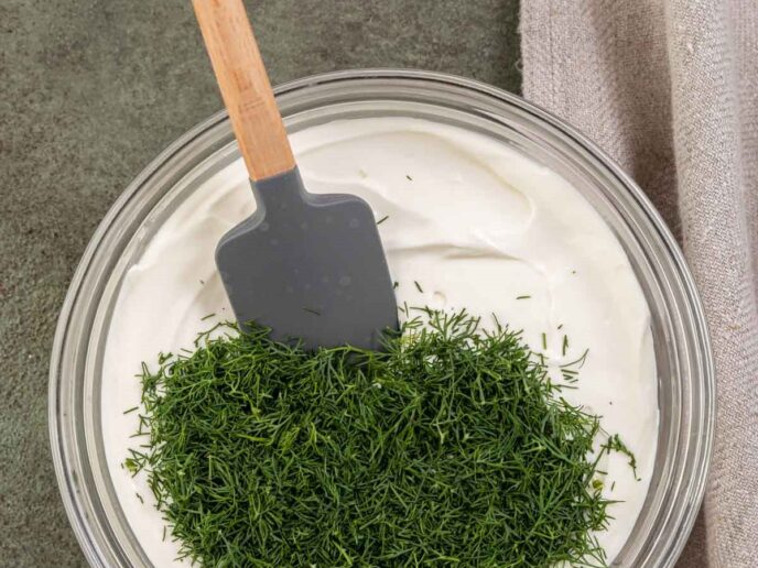 Mixing herbs into dip