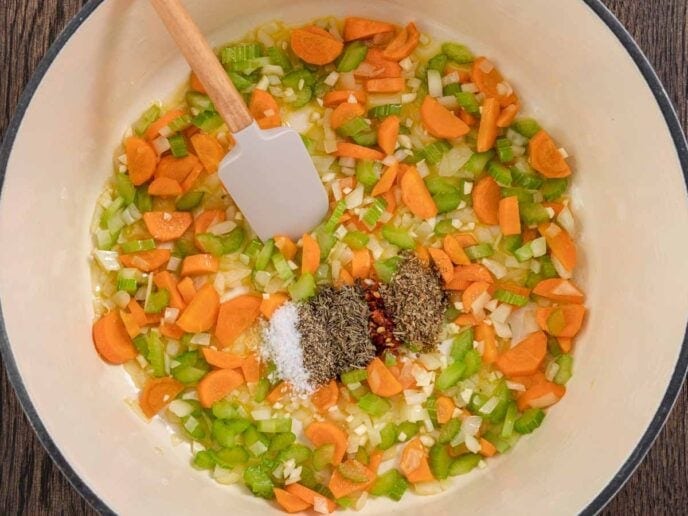 Diced vegetables and seasoning in a pot