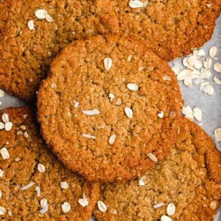 Baked anzac biscuits on a cookie sheet.