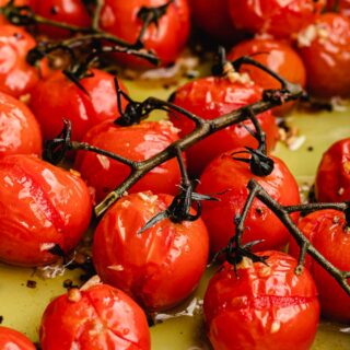 Roasted tomatoes on a vine.