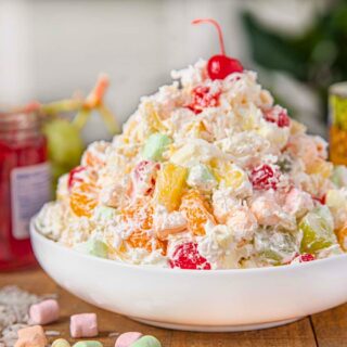 Finished salad piled high in a white bowl