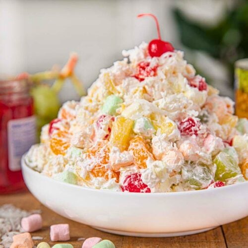 Finished salad piled high in a white bowl