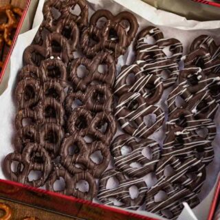 Chocolate coated pretzels lined up in gift box