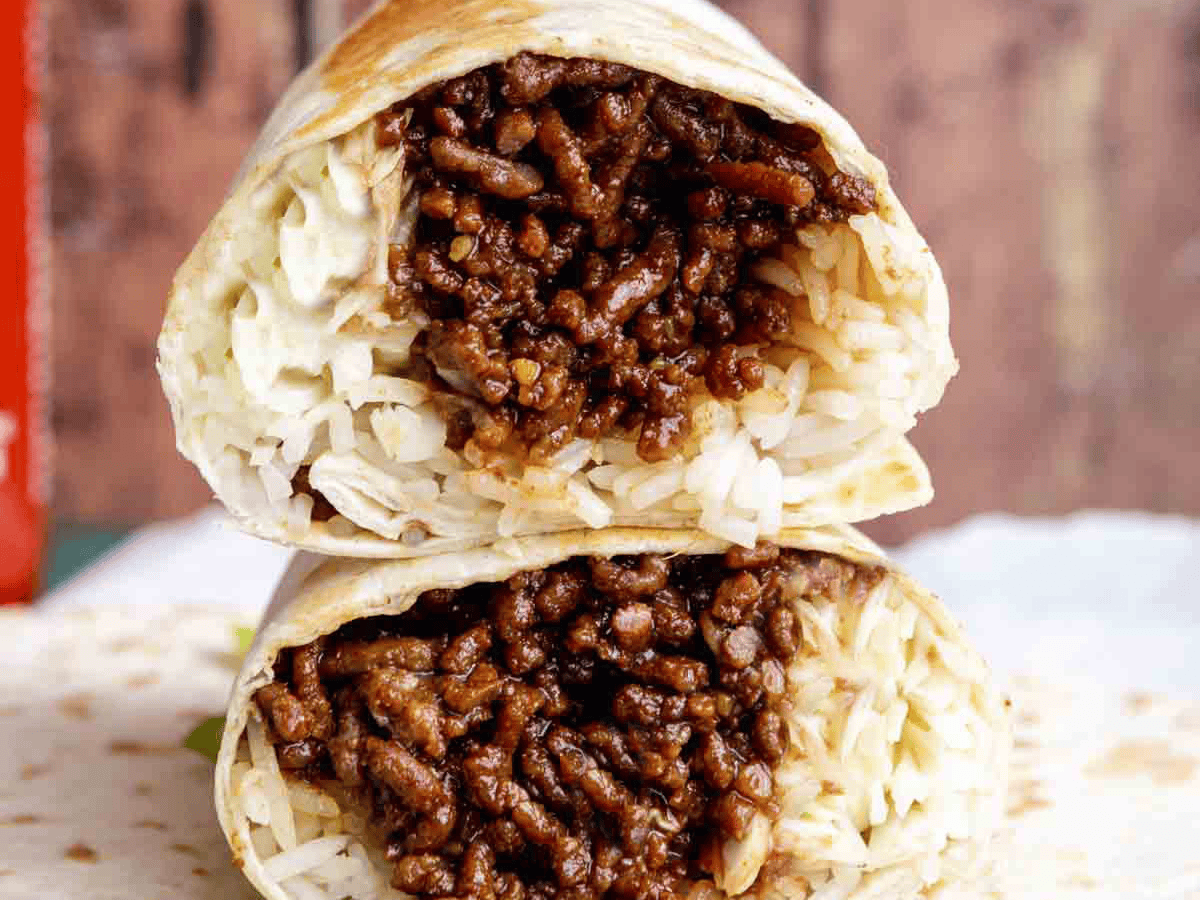 Two halves of a burrito stacked on top of each other.
