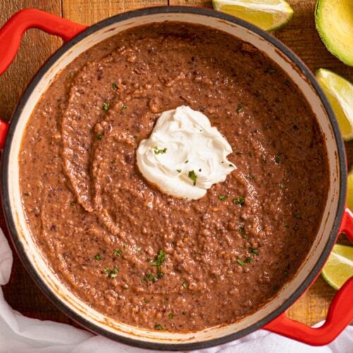 Cooked soup in a Dutch oven with sour cream dollop