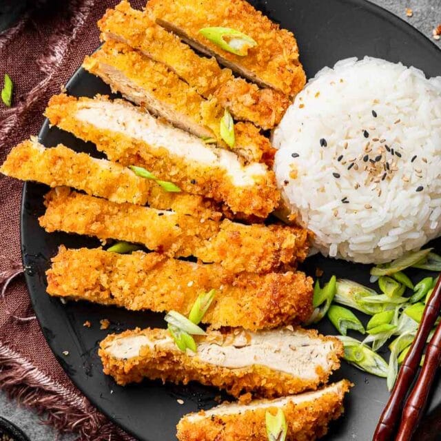 Sliced cooked crispy chicken pieces with rice