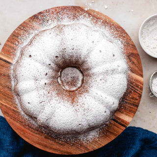 Top down view of whole cake with powdered sugar.