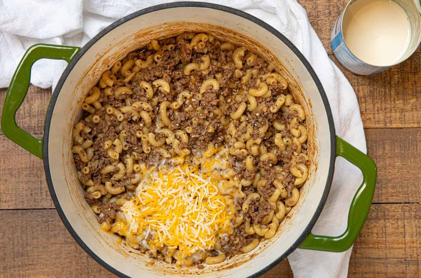 Hamburger Helper is the family friendly dinner you love made from scratch! Quick and easy cheeseburger macaroni, better than the boxed stuff! Made with one-pan and ready in 30 minutes! Cooked meat and pasta topped with cheese before mixing