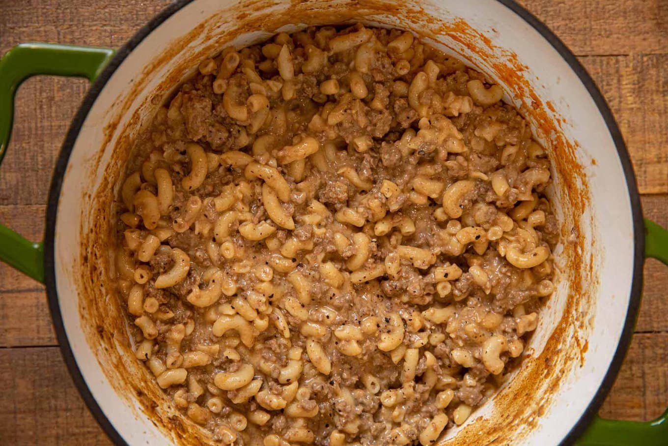 Hamburger Helper is the family friendly dinner you love made from scratch! Quick and easy cheeseburger macaroni, better than the boxed stuff! Made with one-pan and ready in 30 minutes! Cooked macaroni, beef and sauce mixed in pot.