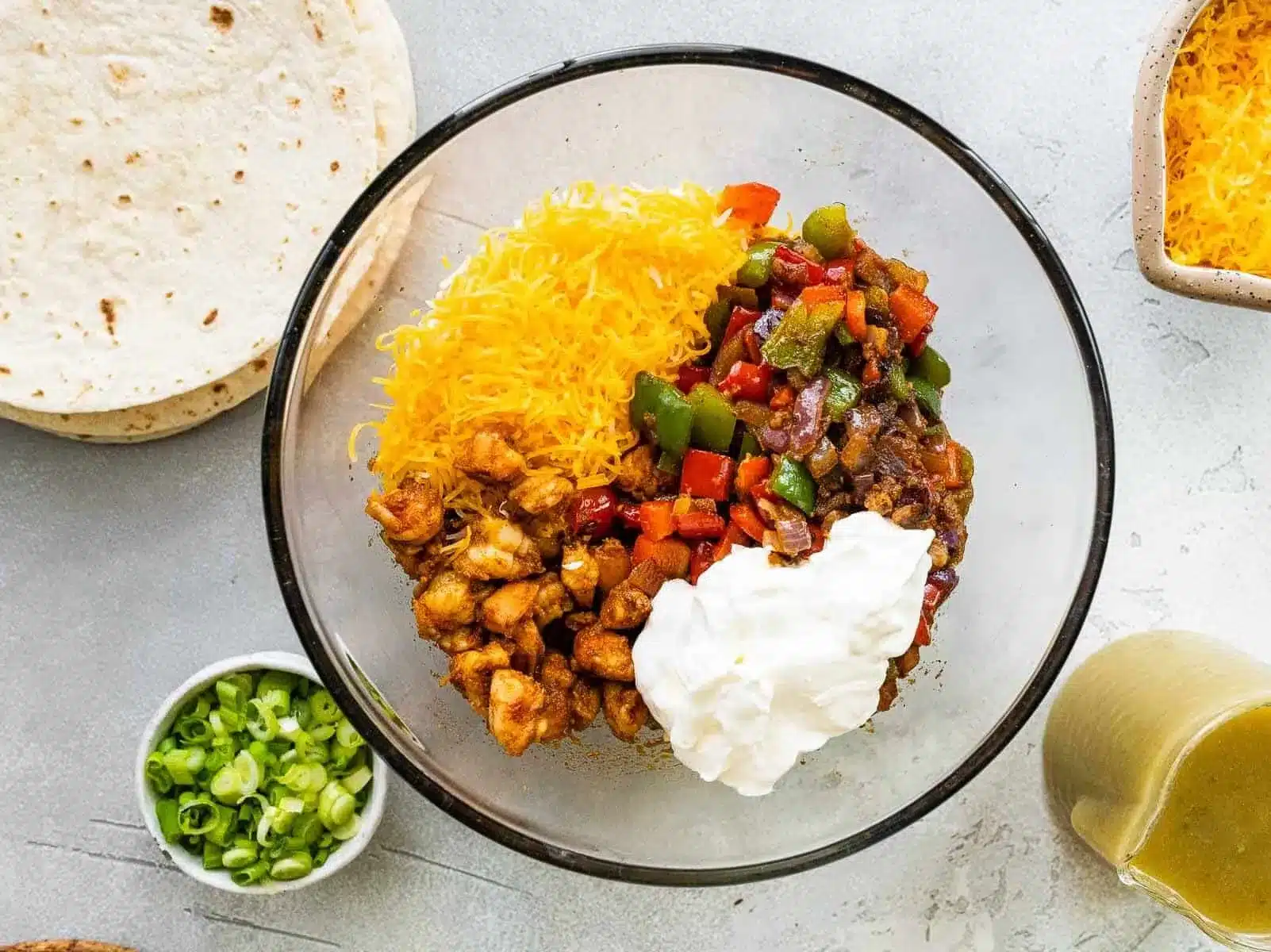 enchiladas with shrimp ingredients in a mixing bowl