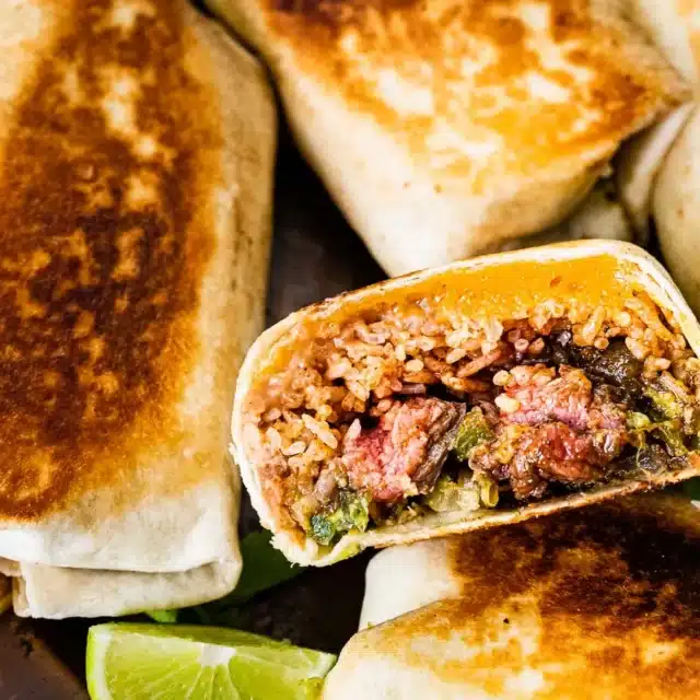 Cooked tortillas filled with ingredients cut in half