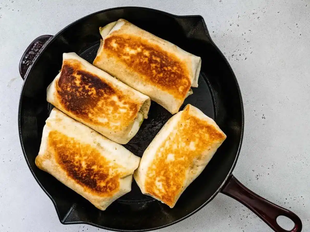 Rolled up tortilla cooked in pan 