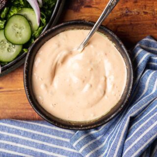 Mixed dressing in a bowl with spoon.