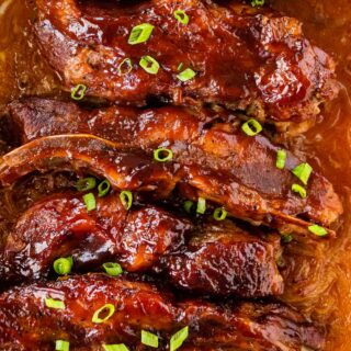Baked country style ribs in casserole dish.