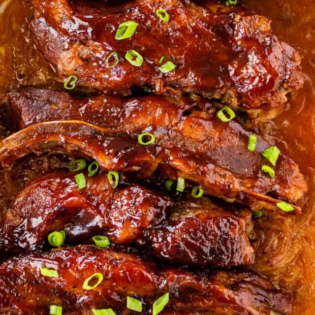 Baked country style ribs in casserole dish.