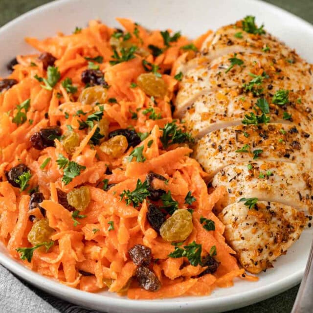 Mixed salad portion plated with chicken breast