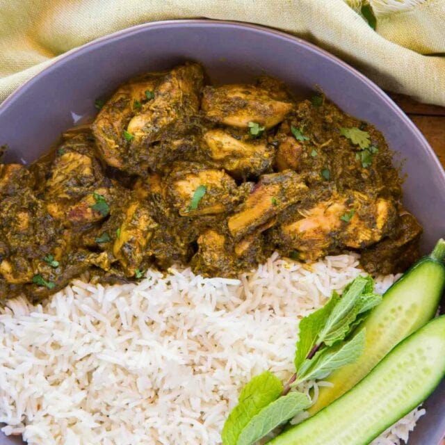 Chicken spinach curry in a bowl with rice