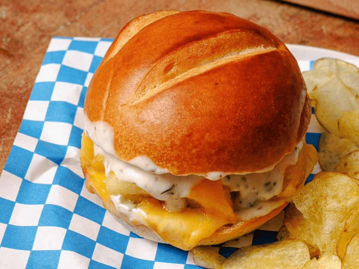 fish sandwich on plate with chips