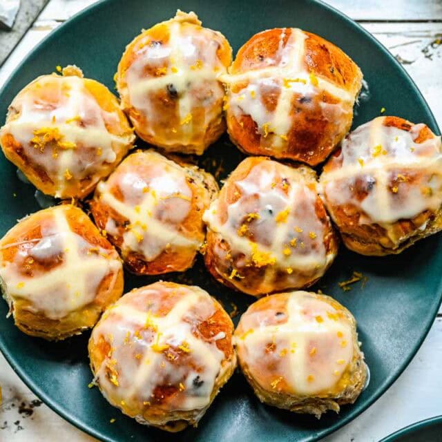 Glazed baked buns on plate