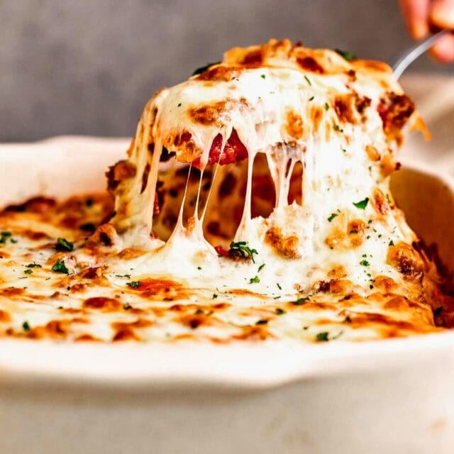 Serving Manicotti from baking dish