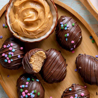 Decorated chocolate peanut butter eggs on platter