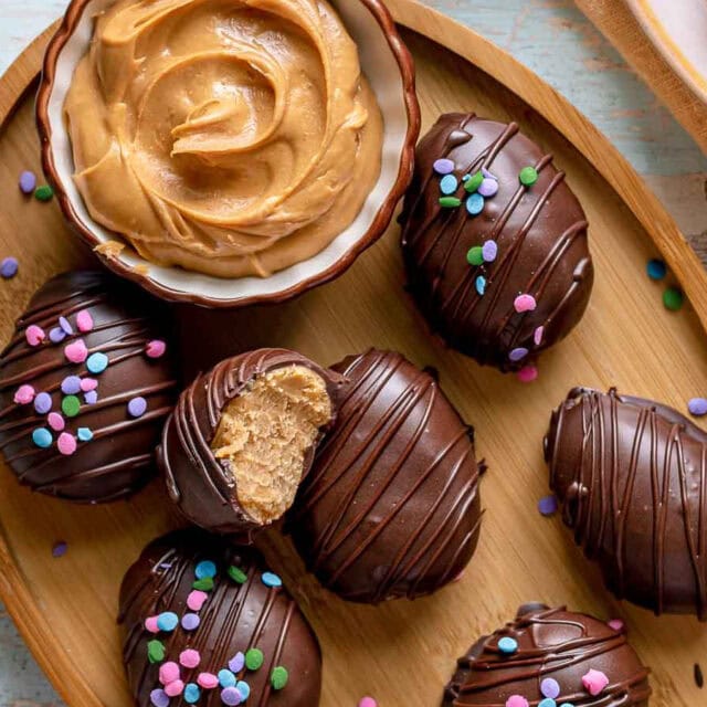 Decorated chocolate peanut butter eggs on platter