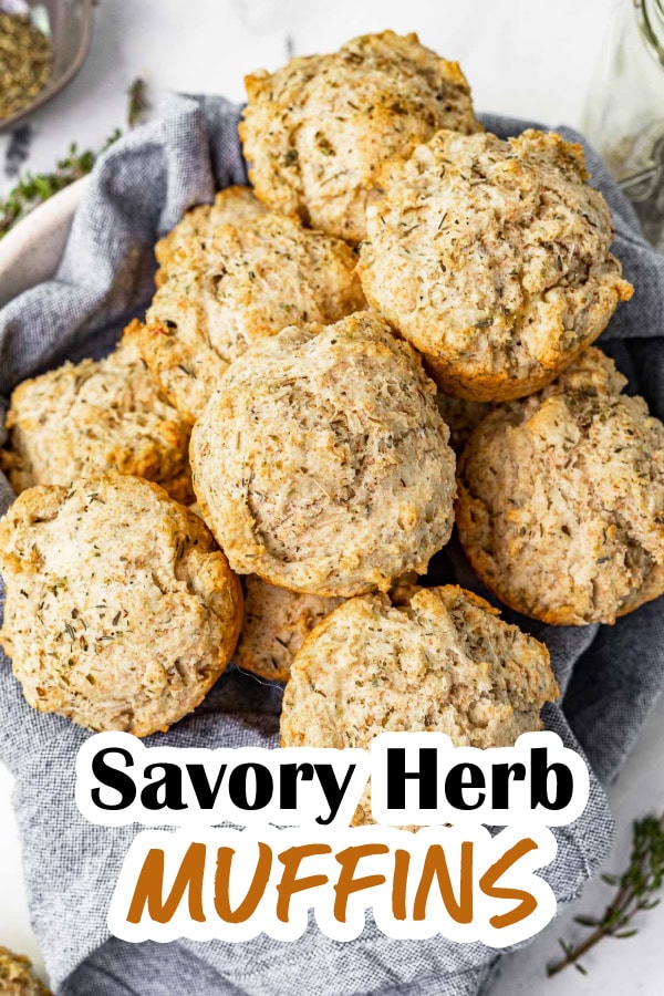 Savory Herb Muffins are deliciously buttery and flavored with oregano, thyme, and garlic. They're a comforting easy side dish for any meal. Basket of baked muffins with recipe name across bottom
