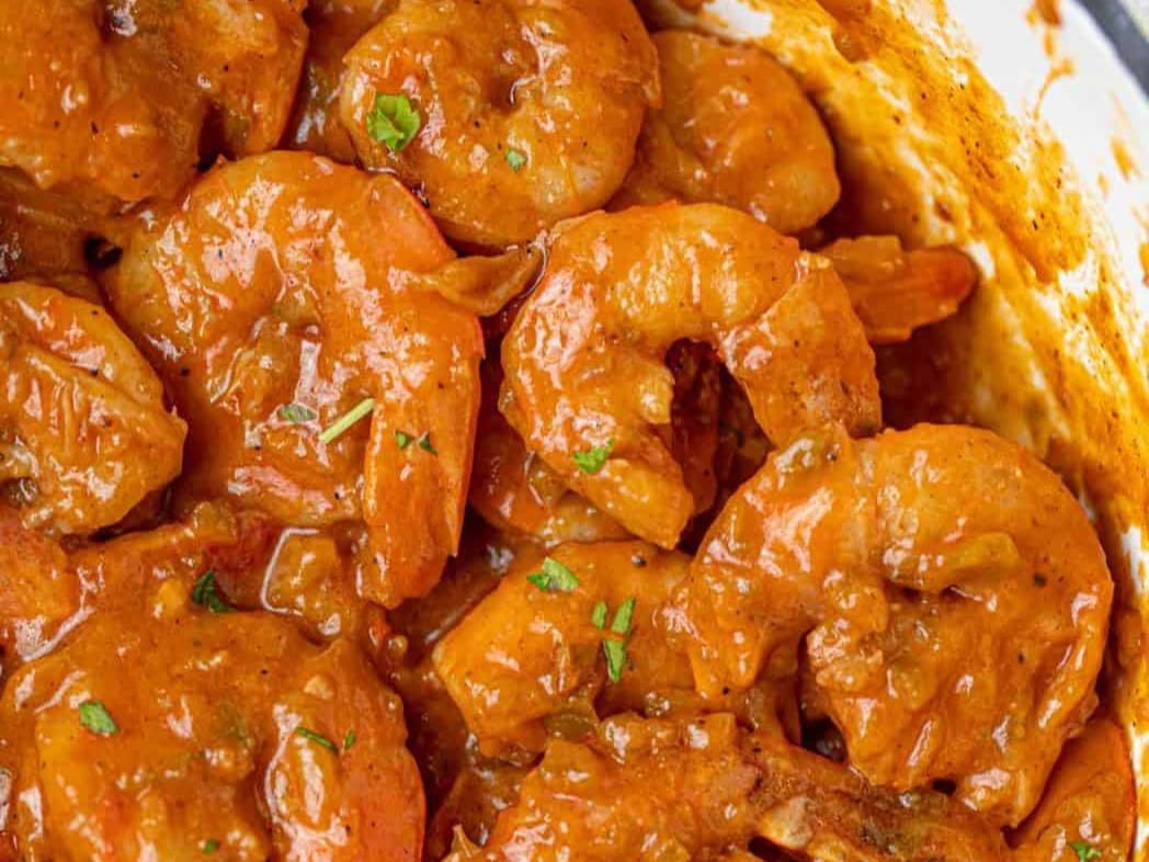 close up of cooked shrimp and sauce