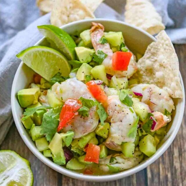 bowl of shrimp and veggies with chips