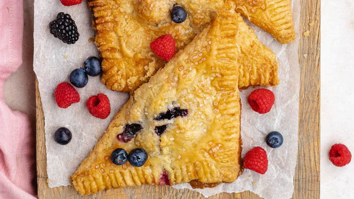 Berry turnovers on serving board.