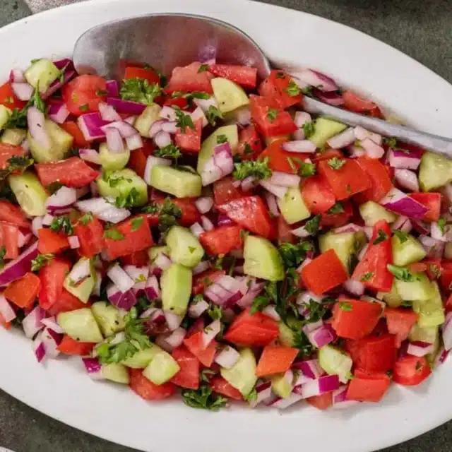 Mixed veggies and herbs mixed together ready to be served