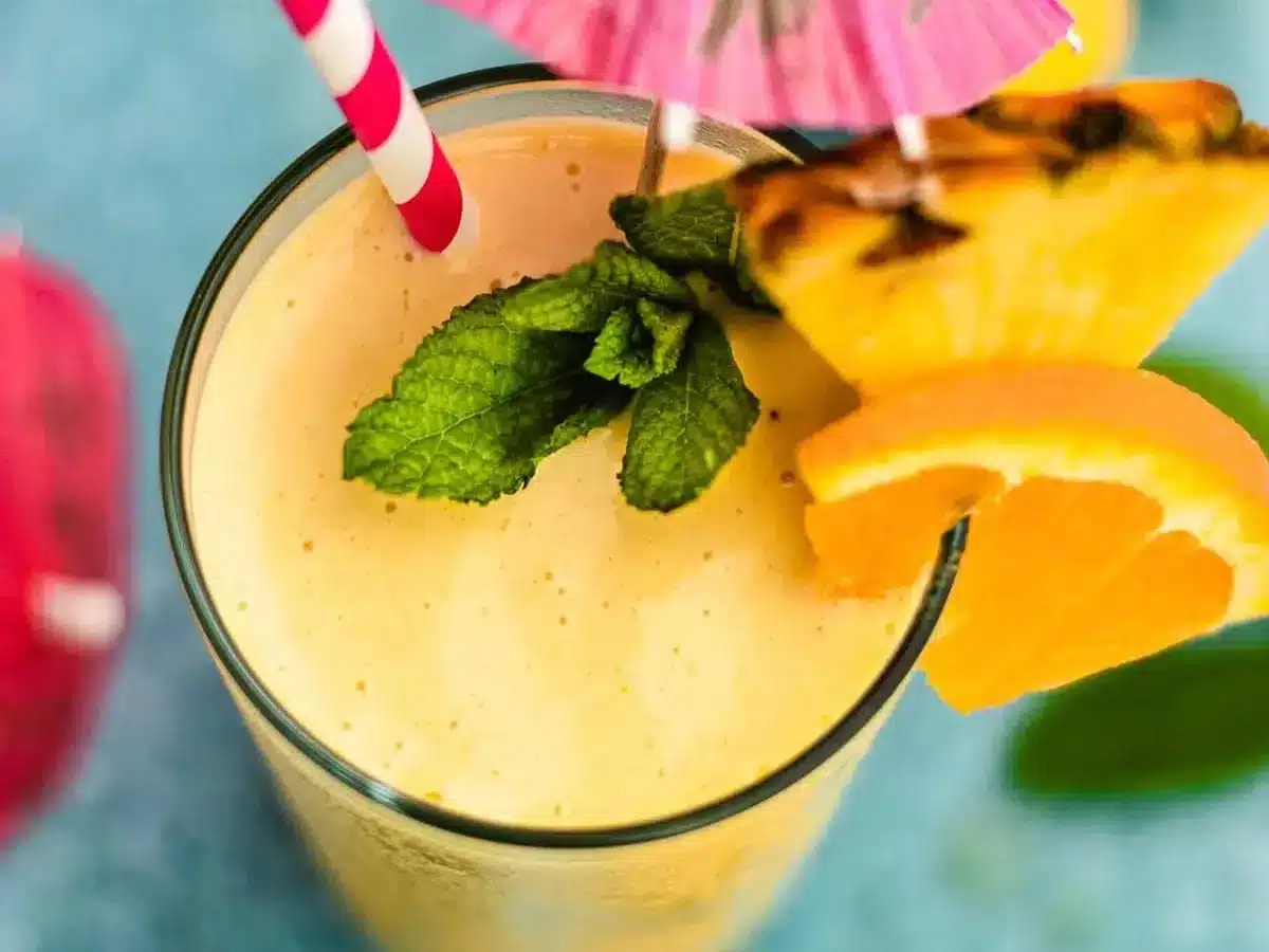 Top view of drink with straw and garnishments 