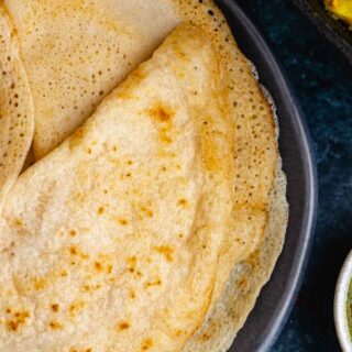 Indian crepes on a serving plate.