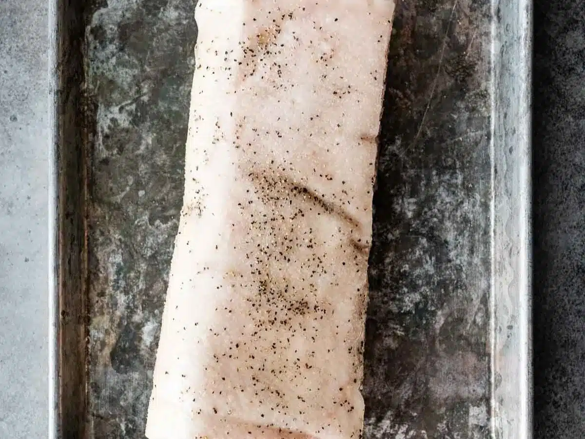 Large piece of raw pork with the layer of fat left on.