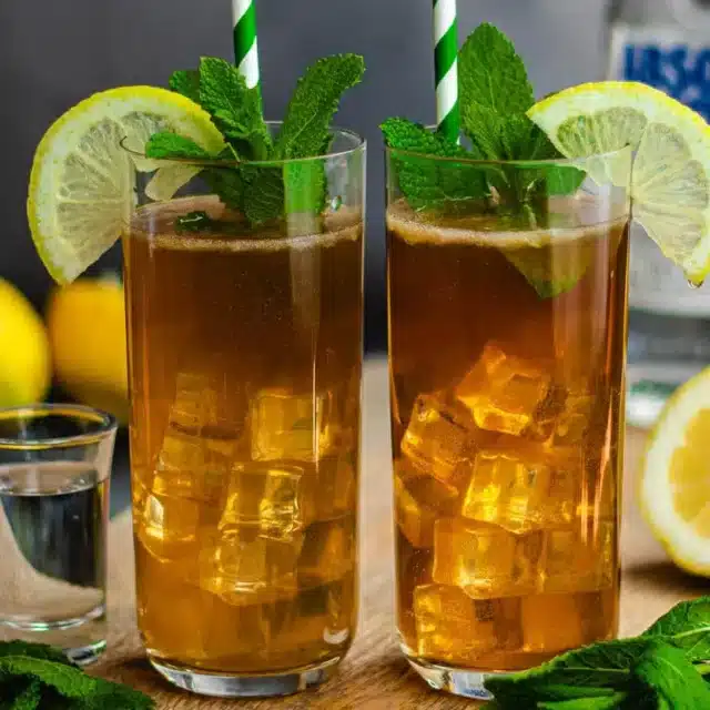 finished drinks garnished with mint and lemon