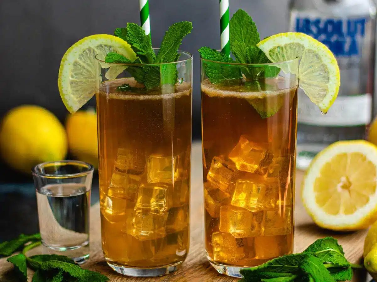 finished drinks garnished with mint and lemon 