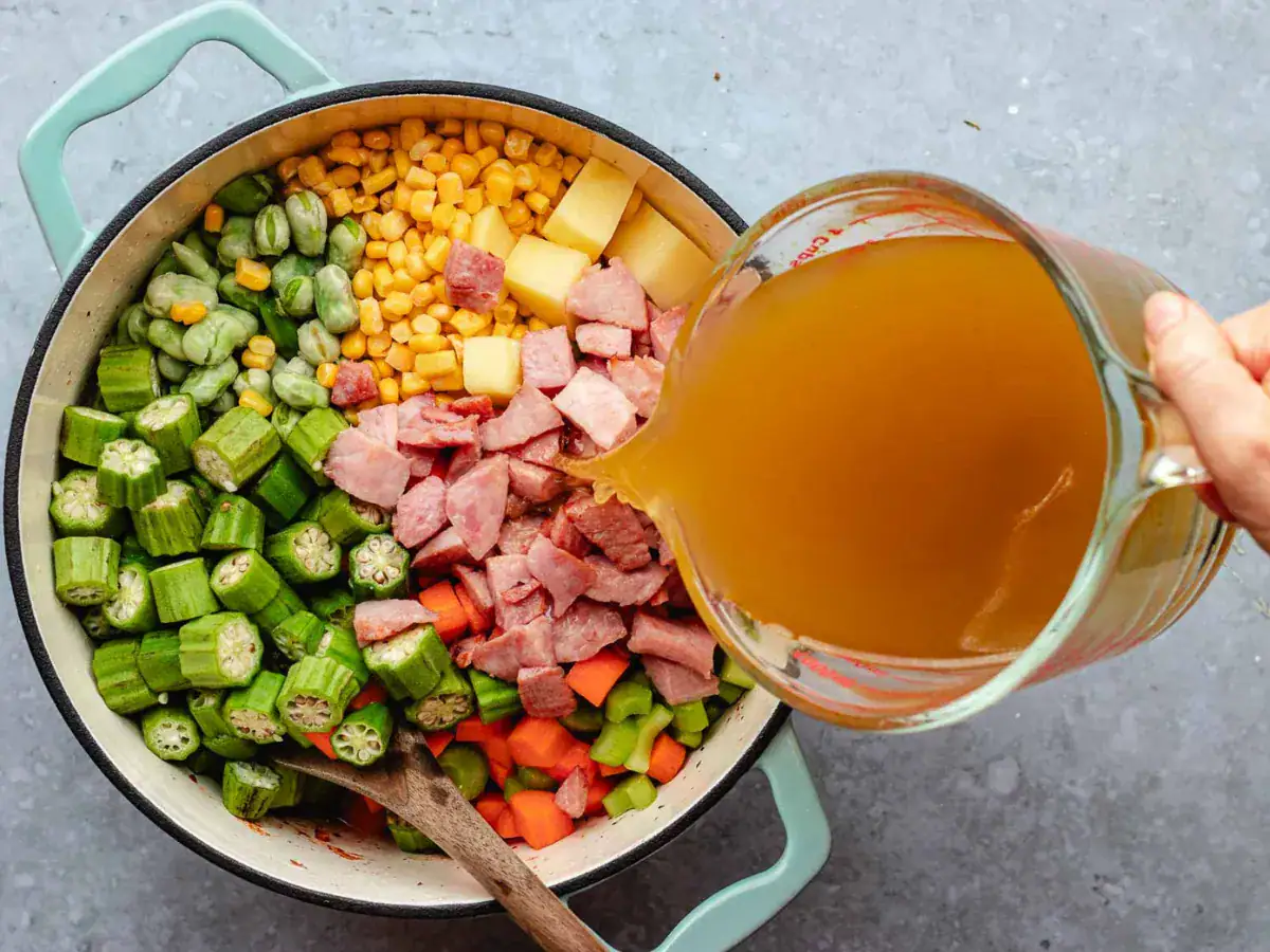broth pouring over ingredients in pot