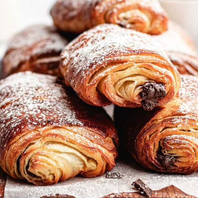 Croissants filled with chocolate and dusted with sugar