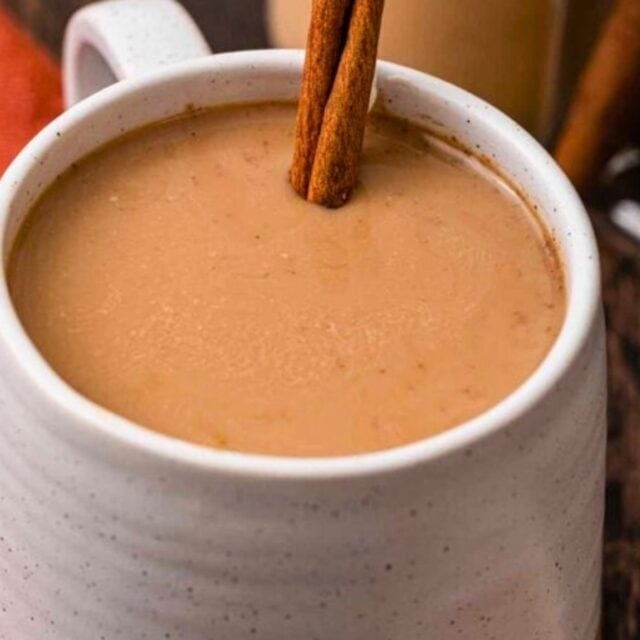 Mug of coffee with creamer