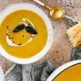 soup with a piece of bread and a spoon