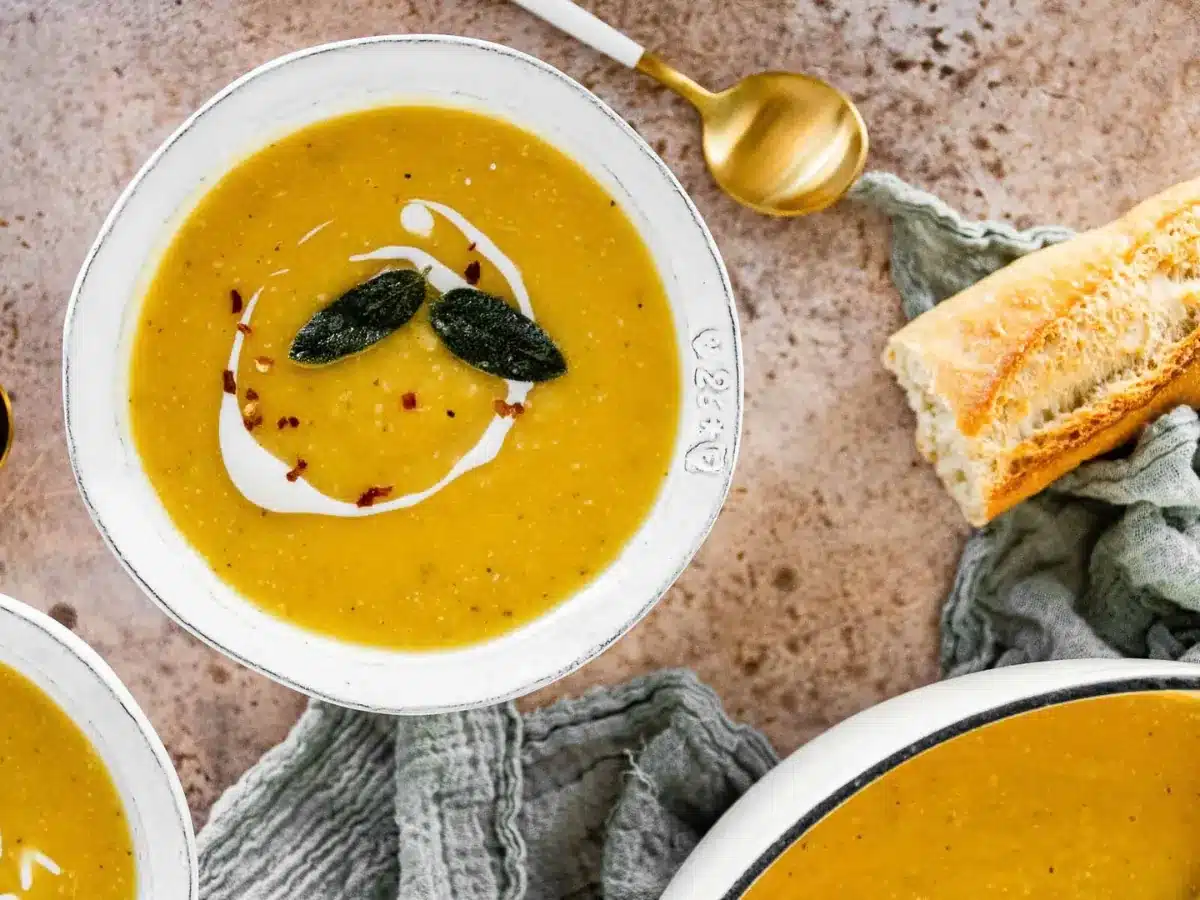 soup with a piece of bread and a spoon 