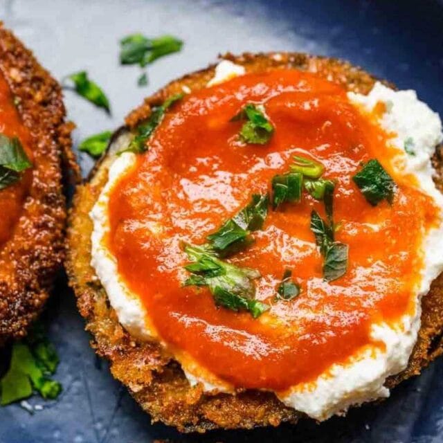 Breaded eggplants topped with cheese and sauce