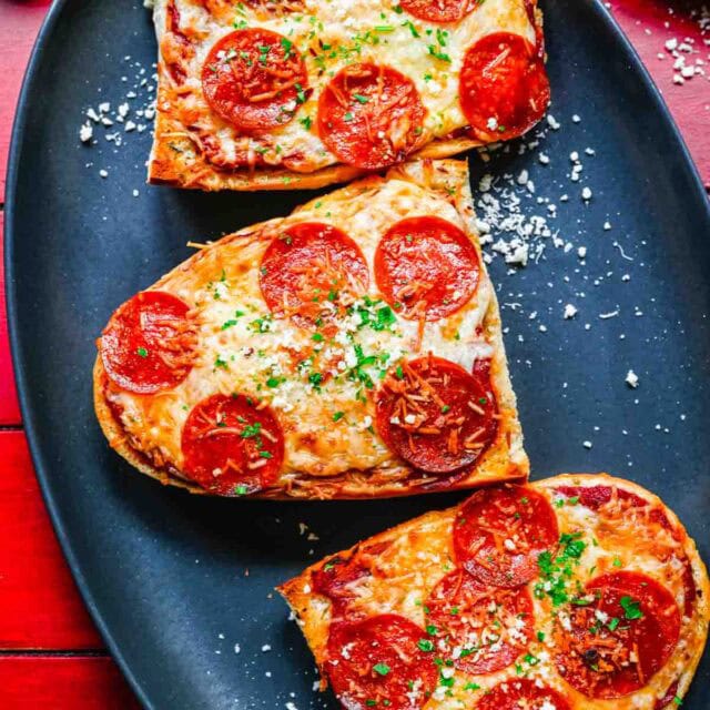 Slices of pepperoni pizza on dinner plate 1x1